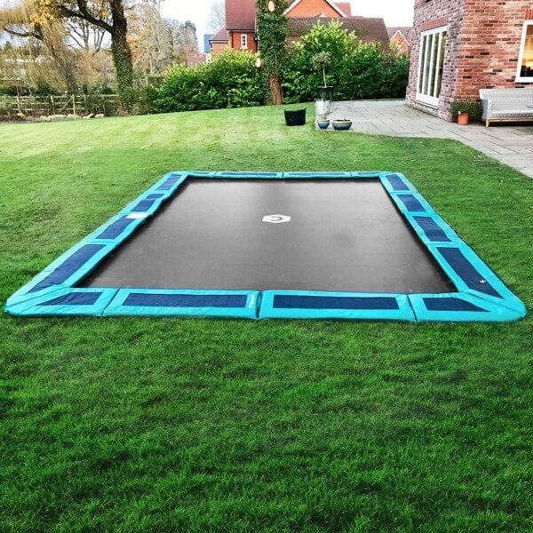 A green 14 x 10 rectangular inground trampoline